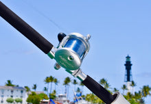 Load image into Gallery viewer, avet 6.0 reel on custom rod in front of lighthouse point lighthouse
