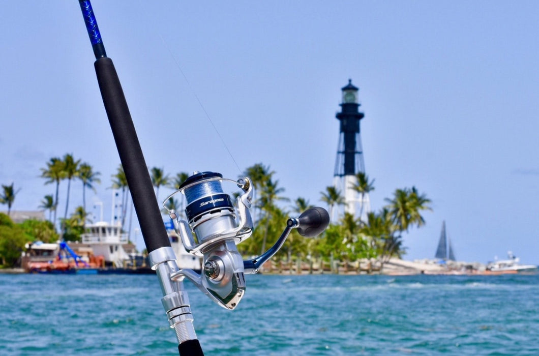 Shimano Saragosa 8000 sw spinning reel on custom rod in front of light house
